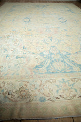 A long perspective view down the distressed Bulgarian Polonaise carpet, highlighting its faded pastel hues.