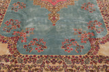 Rococo style leaves and millefleur sprays on the vintage Kerman's plush powder blue pile.