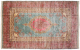 A view down the length of the vintage Kerman carpet, highlighting its full, even wool pile.