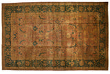 Hand-knotted vintage Agra carpet in copper and deep green with oversized Herati motif.