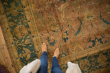 Herati motif showcasing copper, gold, dusty teal, and olive green on vintage Agra carpet.