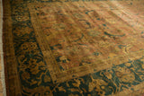 Vintage tea washed Agra carpet, showing Herati motif detail in copper and dusty teal.