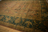 Curvilinear Herati motif on an Indian Agra carpet, rich olive green, gold, and copper tones.