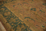 Copper Herati motif field and dusty teal floral border on a vintage hand-knotted Agra rug.