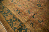 Curvilinear Herati motif on vintage Agra carpet border in dusty teal and copper.