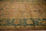 Agra carpet's Herati pattern, showing a copper field and dusty teal floral border.