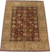 Angled view of a vintage Agra carpet with a cherry red field and wide beige palmette border.