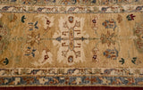 Full hand-knotted pile showing a stylized palmette and border on a beige Agra carpet.