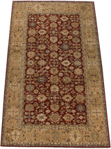 Hand-knotted Agra carpet with oversized palmettes shown from an angled, full-length perspective.