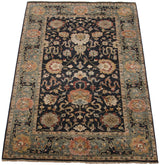 Angled perspective of a vintage Agra carpet showing its allover floral design.