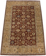 Angled view of a vintage Agra carpet with a cherry red field, oversize palmettes, and a wide beige border.