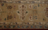 A large palmette motif with nuanced color fills next to the wide main border of the Agra carpet.