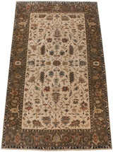 High-angle perspective of an Indian Serapi carpet with sprawling vinery and a deep olive border.