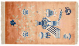 Vintage Peking rug featuring a pictorial vase, blossoms, tea set in copper and blue.