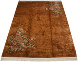 Vintage Chinese Art Deco carpet, copper field, embossed carving, blush floral motifs.