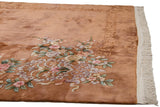 Vintage Art Deco carpet with dimensional carved floral motifs in blush, mauve, and copper