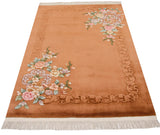 Vintage Chinese Art Deco rug with shadow embossed copper field and pastel flowers.