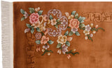 Dimensional carved pink and mauve Art Deco floral design on copper rug with fringe.
