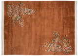 Corner detail of Art Deco carpet, featuring copper field, shadow-embossed border, and floral motifs.