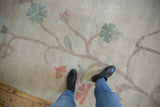 Close-up vintage Chinese Arts and Crafts rug, oversize green and terra cotta blossoms.