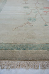 Full ivory fringe and abrashed green banded border of this Chinese Arts and Crafts rug.