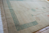 Vintage Chinese Arts and Crafts carpet, ivory field, abrashed ocean green border, uniform pile.