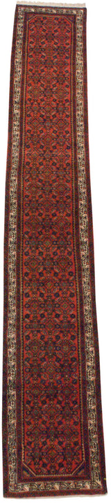 Detail of vintage Engelas runner: geometric vine border and cherry red Herati field.