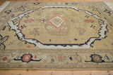 Vintage Armenian Serapi rug's lower border featuring multi-banded stylized designs in sand, ivory, and black.