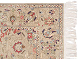 Hand-knotted Sultanabad rug corner with scrolling vinery border and clean, intact ivory fringe.
