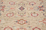 Full wool pile detail showing interconnecting vinery and floral palmettes in red and blue.