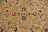 Geometric quatrefoil medallion with serrated outlines and floral sprays in wheat, gold, and dusty navy blue.
