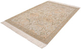 Cream fringe, geometric border, and apricot palmettes on a vintage Armenian Sultanabad rug.