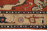 Detail of the Armenian carpet's Serapi design border, showing the full pile in red, navy, and sand.