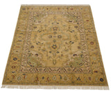 Samovar turtle motif and vine details on the vintage Armenian Heriz rug's outer border.
