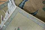 Armenian toucan rug's tight hand-knotted foundation, light blue border, and white fringe.