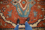 Detail of vintage Armenian Serapi rug, bold madder red and sky blue patterns, full pile.