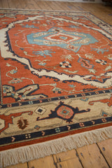 Vintage Armenian Serapi rug corner with beige geometric border and ivory fringe.