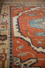 Vintage Armenian Serapi rug, deep madder red field, sky blue curvilinear motifs, and intact selvage.