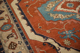 Armenian Serapi rug detail: blue, red, beige curvilinear pattern and border.