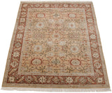 Angled view of a vintage Armenian rug showcasing its intricate roundel palmettes and rust border.