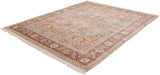 Angled view of a vintage Armenian Sultanabad carpet showing its full floral field and rust-toned border.