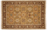 Vintage Armenian Sultanabad carpet with fiery palmettes on a saffron gold field with a dark rust border.