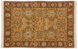 Vintage Armenian Sultanabad rug with scrolling vinery and palmettes on a saffron yellow field.