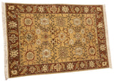 Angled view of a vintage Sultanabad rug highlighting the allover field of roundel palmettes.