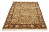 Angled view showcasing the scrolling vinery and palmettes of the vintage Sultanabad rug.