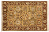 Allover pattern of a vintage Armenian rug with interconnected rust palmettes and vines on a gold field.