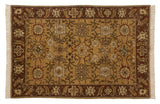 Vintage Armenian rug with fiery palmettes and scrolling vinery on a saffron yellow field.