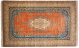Vintage Bulgarian Kerman carpet in terra cotta with a central millefleur medallion and sky blue borders.