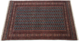 Angled view of a fine Bokhara carpet highlighting the lustrous pile and detailed gul medallions.
