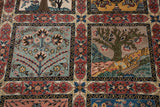 Close-up of the vintage carpet's paneled design with Four Season and tree of life motifs.